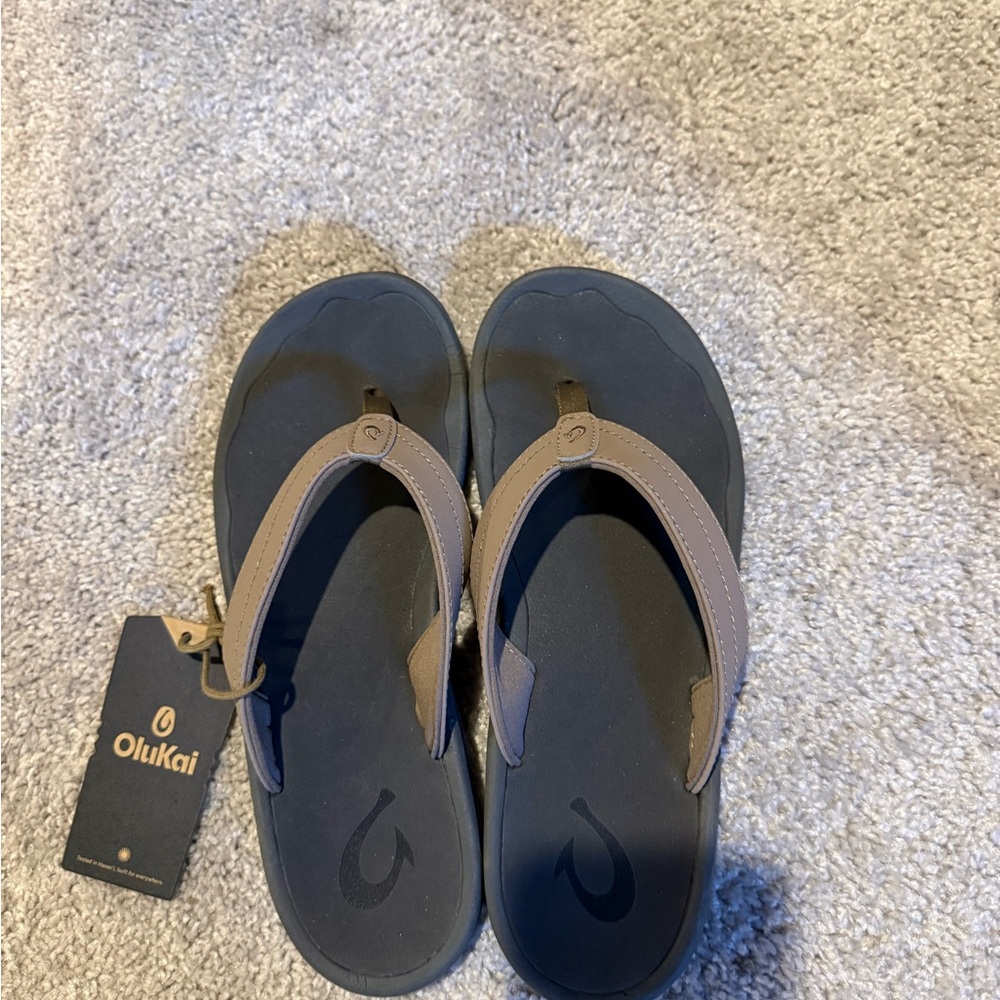 OluKai Black and Tan Flip-Flops